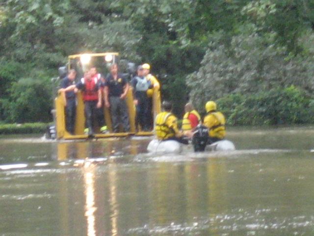 Rye Police and Firefighters making a rescue in Indian Village during Hurricane Irene